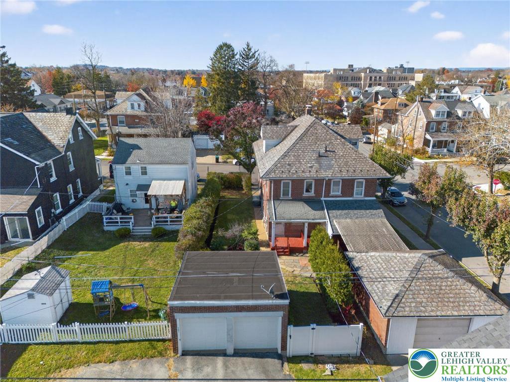 1036 Maple Street Bethlehem, PA 18018 - Photo 48 of 48 an aerial view of a house with swimming pool and a yard