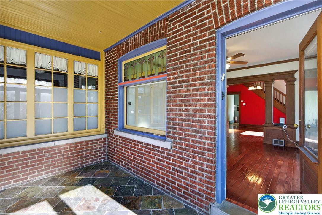 1036 Maple Street Bethlehem, PA 18018 - Photo 5 of 48 a view of a brick house with a door and a chair