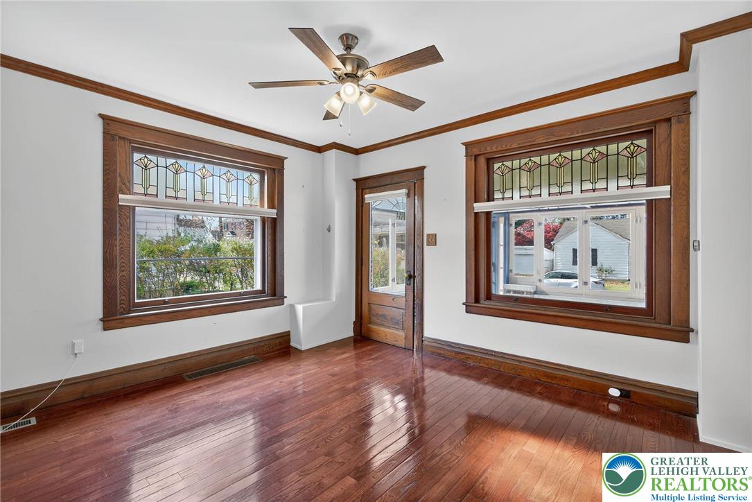 1036 Maple Street Bethlehem, PA 18018 - Photo 8 of 48 a view of an empty room with wooden floor and a window