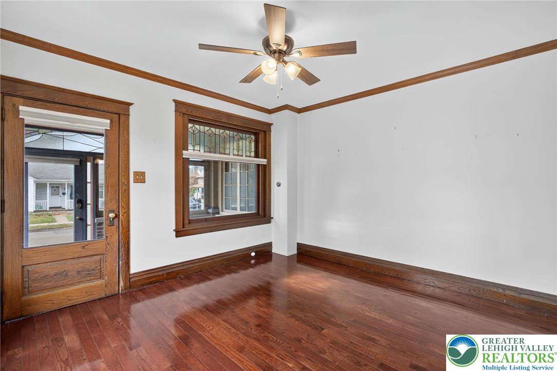 1036 Maple Street Bethlehem, PA 18018 - Photo 9 of 48 a view of an empty room with a window and wooden floor