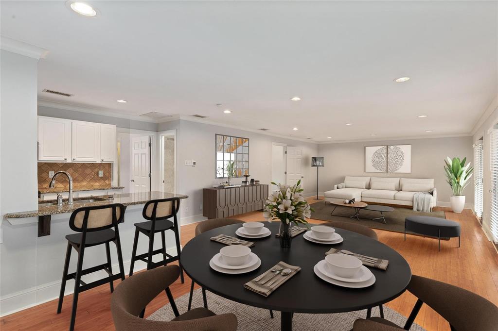7770 Meadow Road, Unit 211 Dallas, TX 75230 - Photo 3 of 12 a view of a dining room with furniture and wooden floor