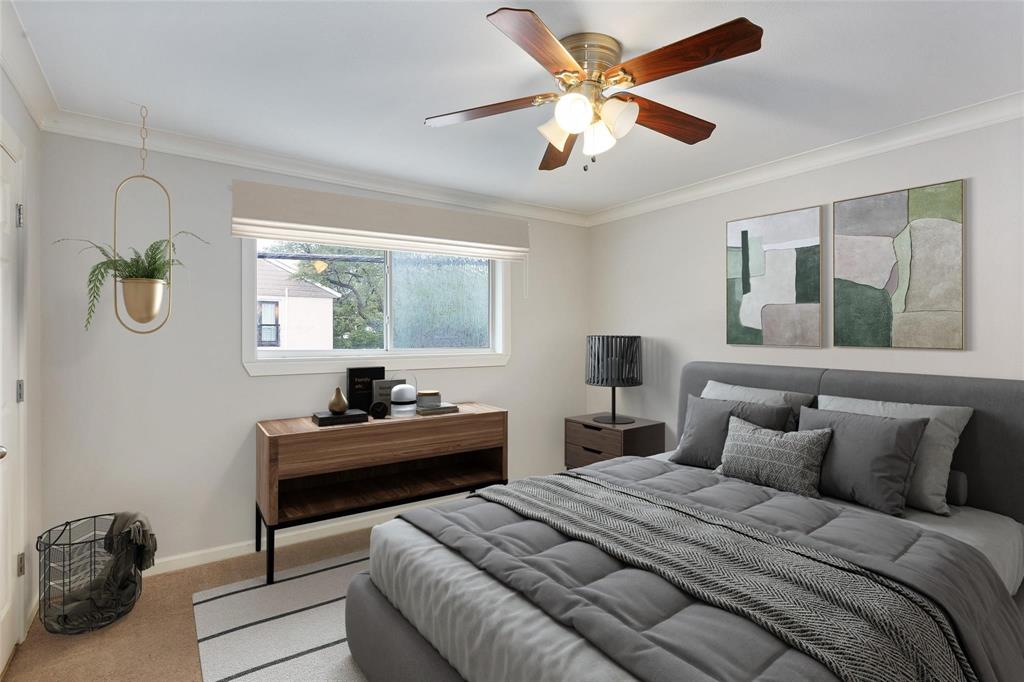 7770 Meadow Road, Unit 211 Dallas, TX 75230 - Photo 6 of 12 a bedroom with a bed and a chandelier