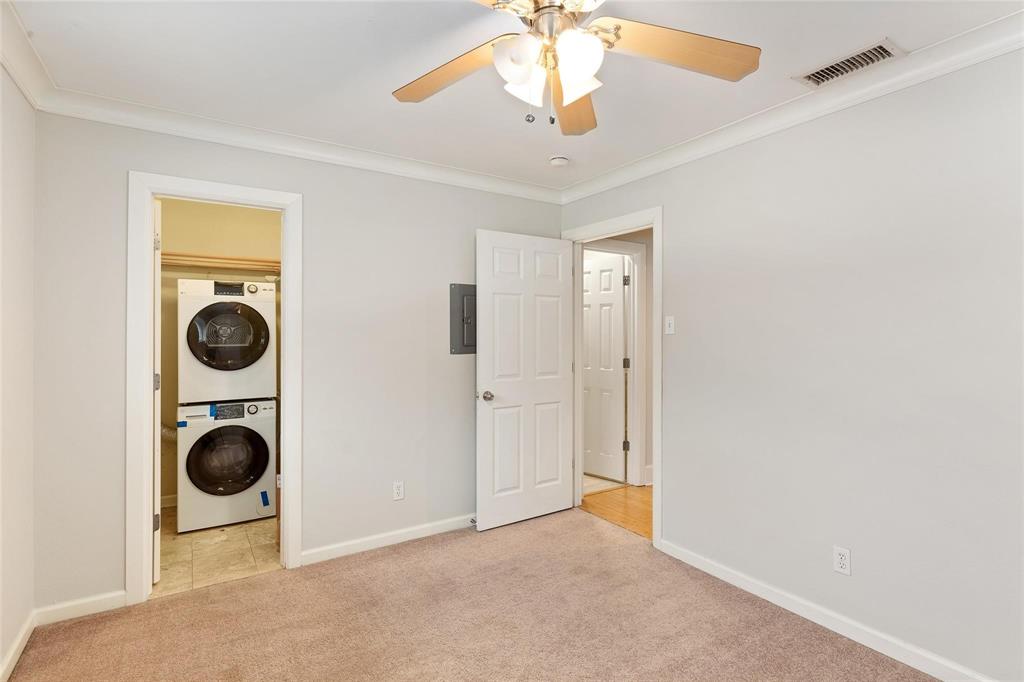 7770 Meadow Road, Unit 211 Dallas, TX 75230 - Photo 9 of 12 a view of a livingroom with a washer and dryer