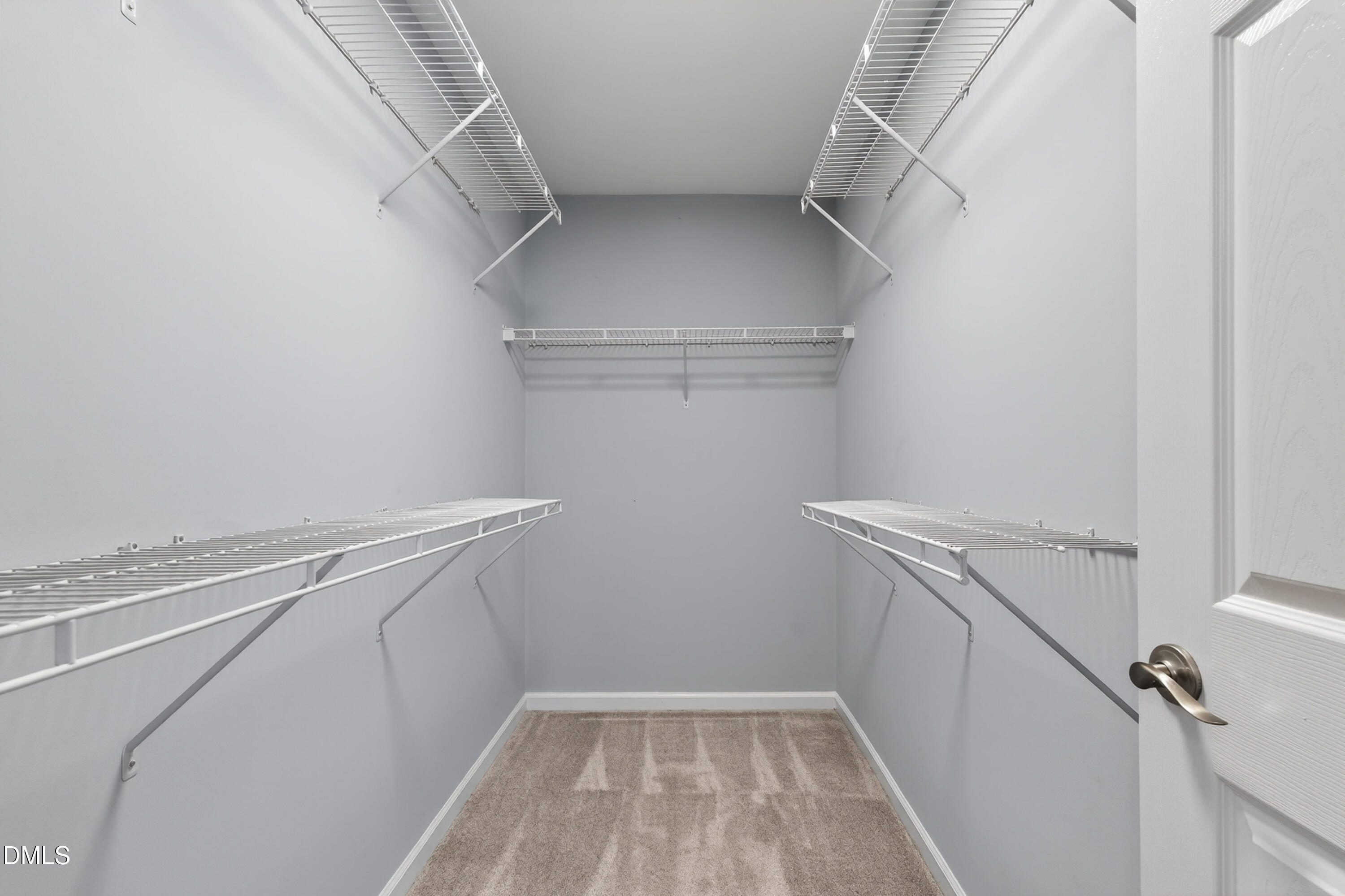 5421 Golden Arrow Lane Raleigh, NC 27613 - Photo 29 of 49 a view of storage and utility room with racks on the wall