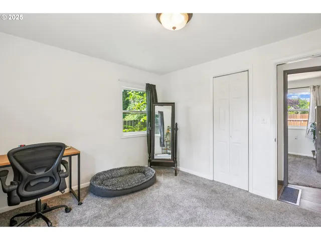 a room with a chair and a window