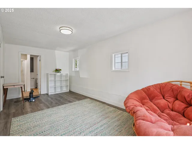 a view of livingroom with furniture and wooden floor
