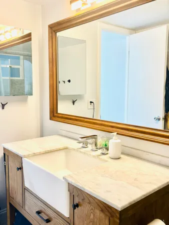a bathroom with a sink and a mirror