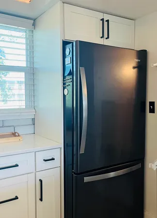 a view of a refrigerator in kitchen and dishwasher
