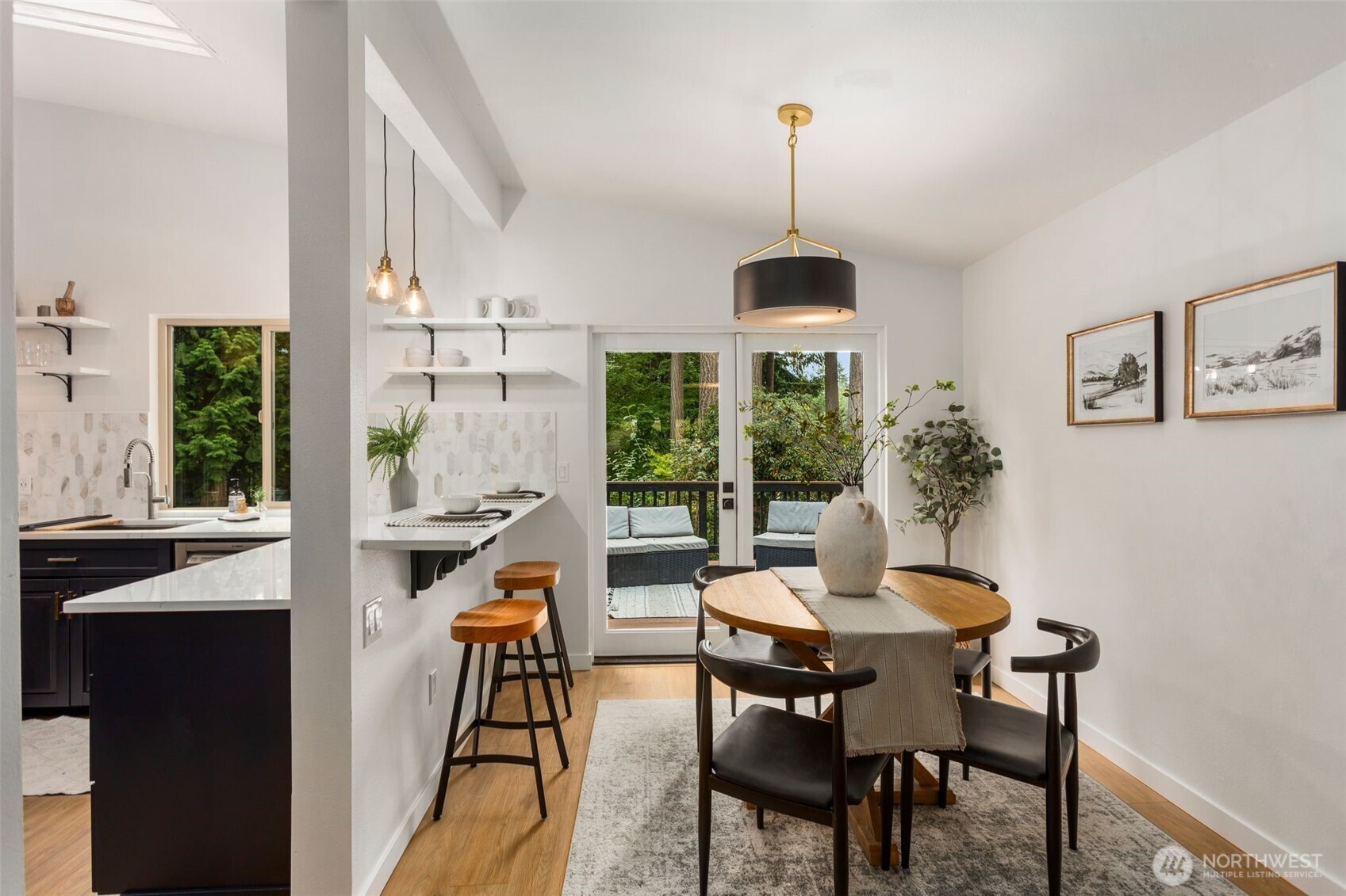 20201 45th Drive Southeast Bothell, WA 98012 - Photo 11 of 38 a dining room with furniture a chandelier and wooden floor