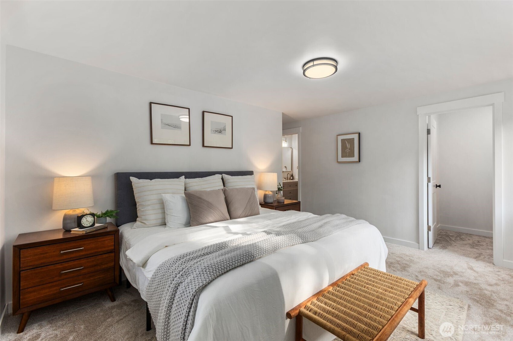 20201 45th Drive Southeast Bothell, WA 98012 - Photo 14 of 38 a bedroom with a bed and a lamp with wooden floor