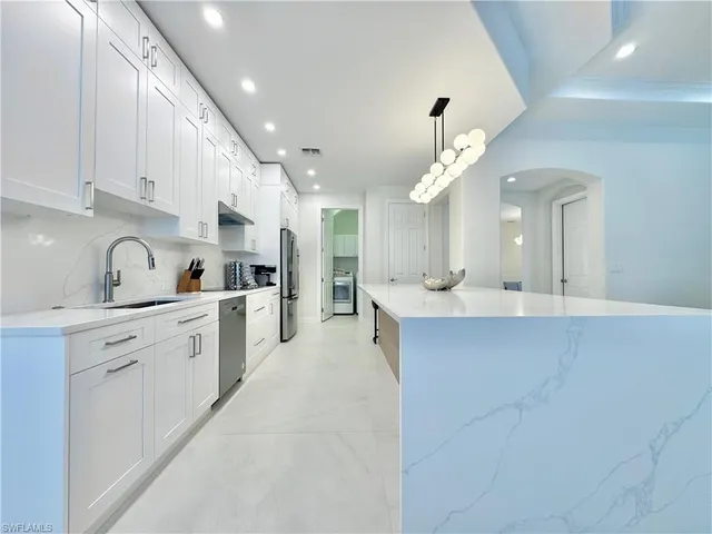 a large kitchen with cabinets