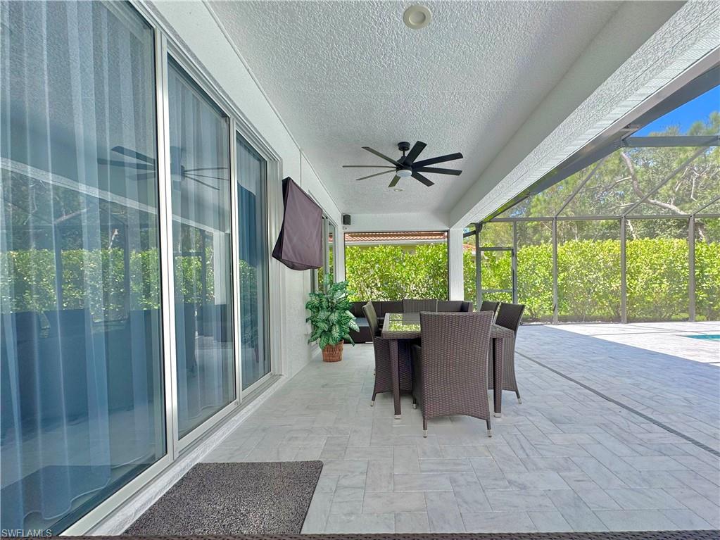 12667 Biscayne Court Naples, FL 34105 - Photo 29 of 41 a dining room with furniture and windows