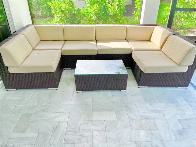 a living room with furniture and a couch