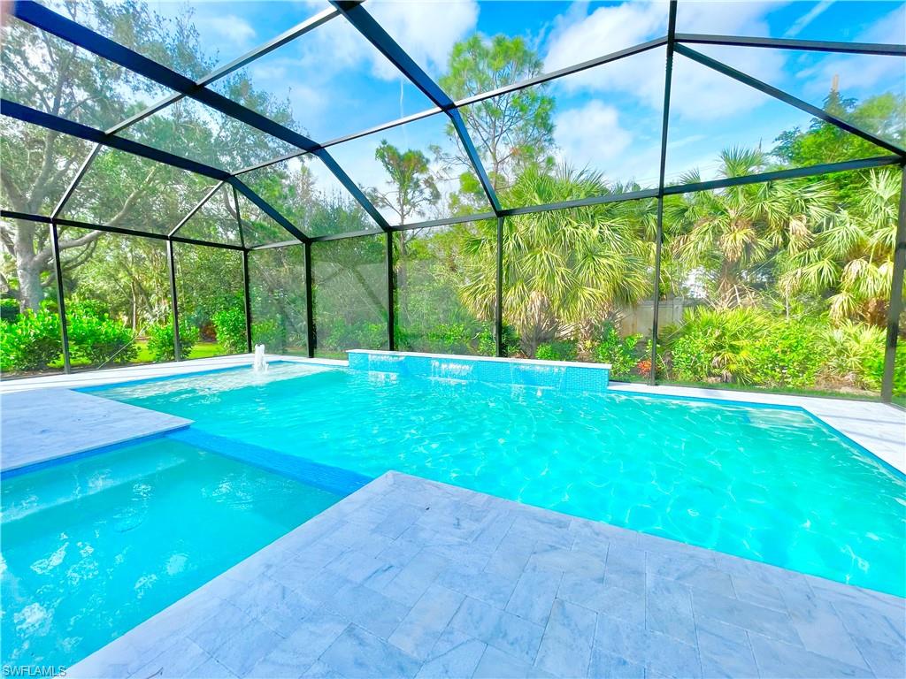 12667 Biscayne Court Naples, FL 34105 - Photo 35 of 41 a view of yard with a small yard