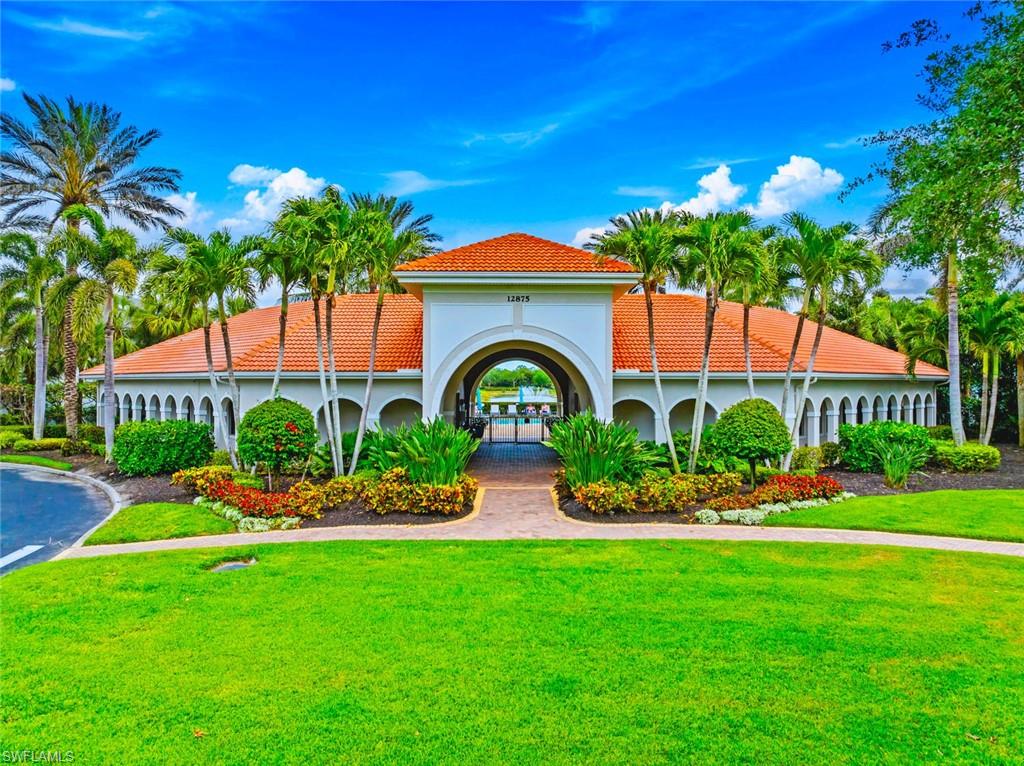 12667 Biscayne Court Naples, FL 34105 - Photo 40 of 41 a front view of house with yard and green space