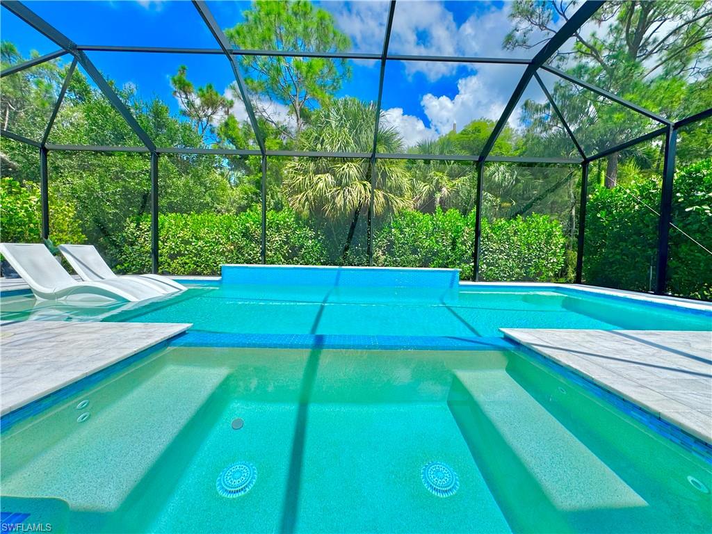 12667 Biscayne Court Naples, FL 34105 - Photo 4 of 41 a view of yard with trampoline