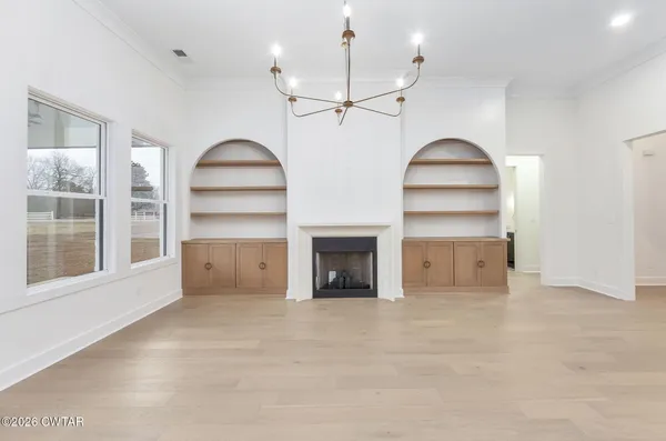 a view of a kitchen with furniture and a fireplace