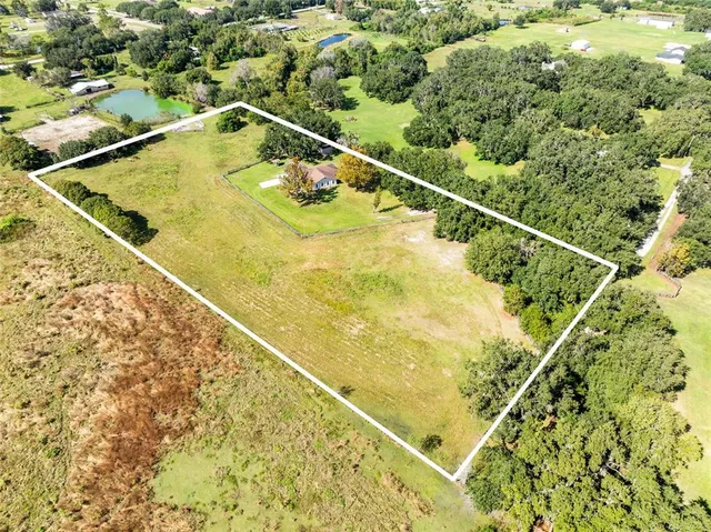 a view of a swimming pool and an outdoor space