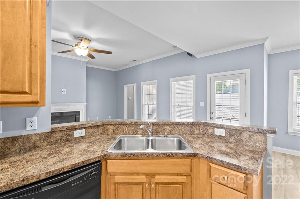 402 Ellicott Lane Locust, NC 28097 - Photo 12 of 41 a kitchen with granite countertop a sink and a window