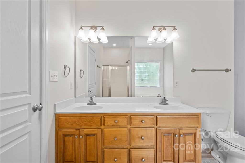 402 Ellicott Lane Locust, NC 28097 - Photo 23 of 41 a bathroom with a sink double vanity and a mirror