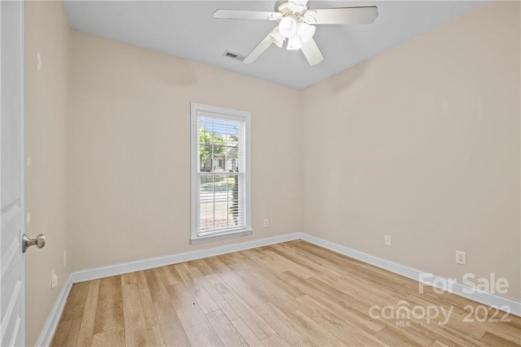 402 Ellicott Lane Locust, NC 28097 - Photo 25 of 41 wooden floor in an empty room with a window