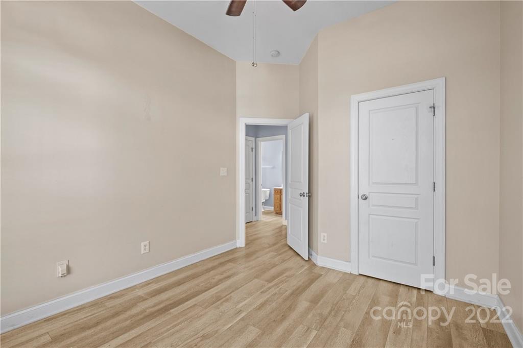 402 Ellicott Lane Locust, NC 28097 - Photo 26 of 41 a view of an empty room with wooden floor