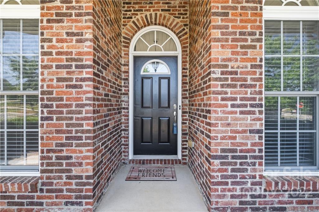 402 Ellicott Lane Locust, NC 28097 - Photo 4 of 41 a view of a brick building with a windows