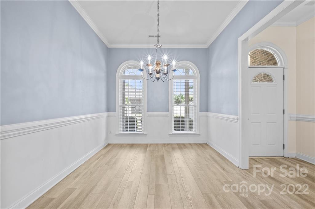 402 Ellicott Lane Locust, NC 28097 - Photo 6 of 41 a view of wooden floor and windows in a room