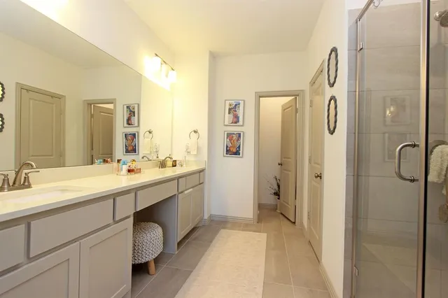 a bedroom with a bed and a desk