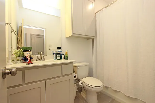 a room with a window and chairs