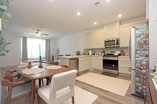 a view of a dining room with furniture
