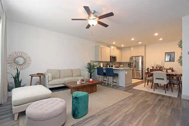 a view of entryway and hall with wooden floor