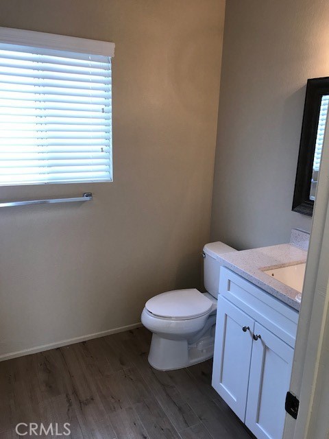 4261 Cedar Drive, Unit 10 San Bernardino, CA 92407 - Photo 12 of 15 a bathroom with a toilet a sink and a window