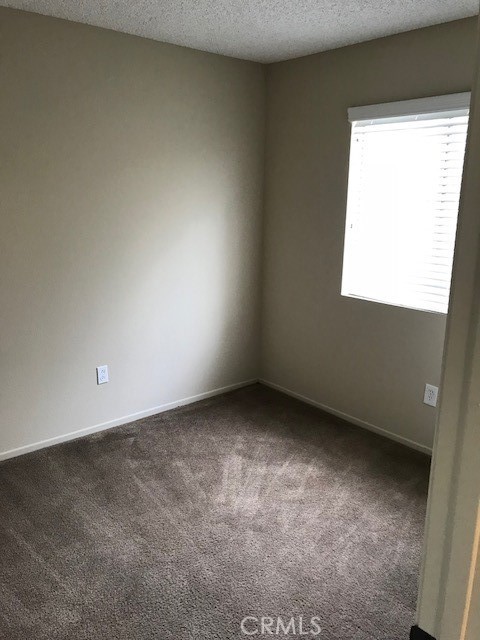 4261 Cedar Drive, Unit 10 San Bernardino, CA 92407 - Photo 15 of 15 an empty room with a window