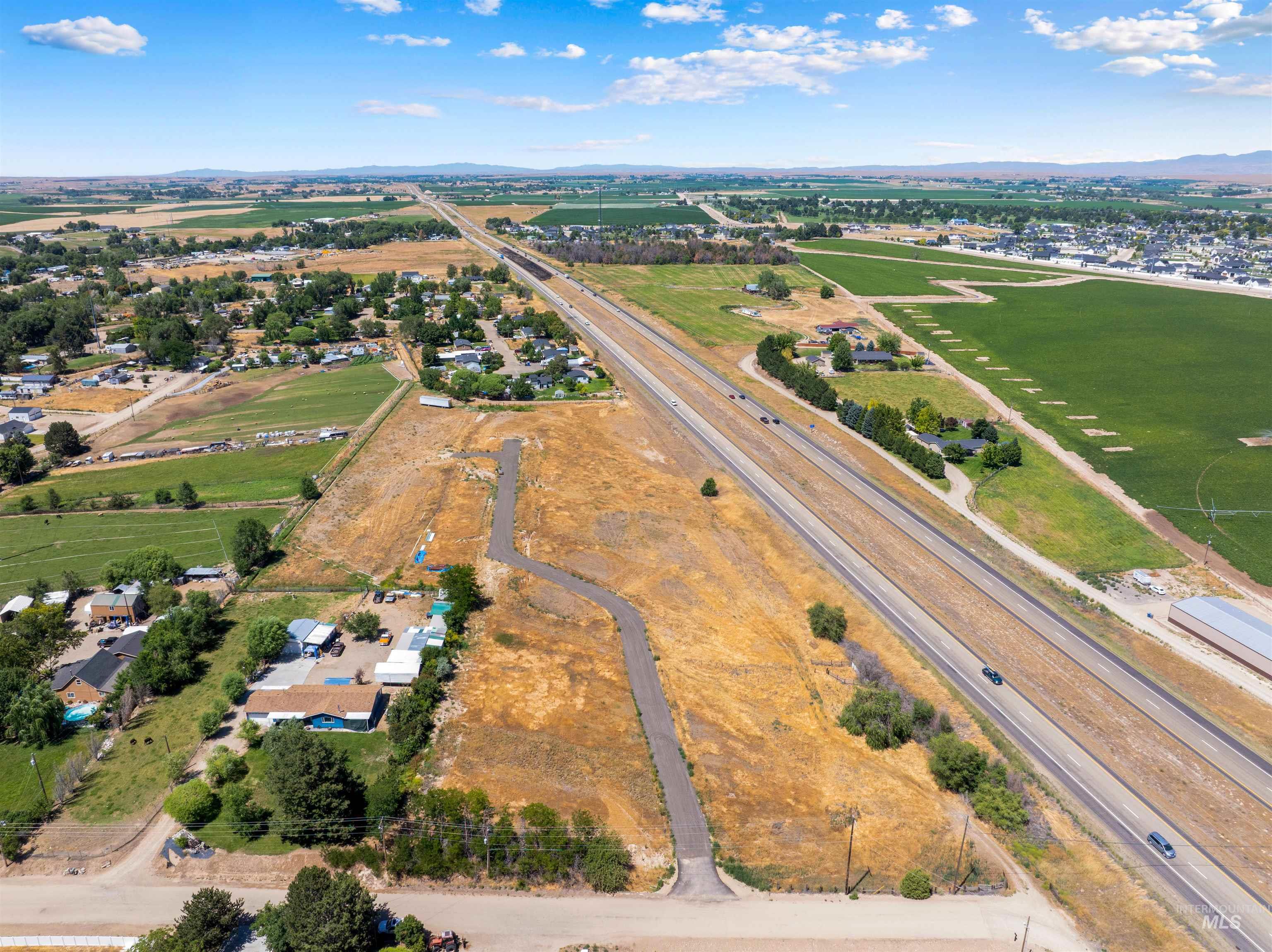 Aerial overview of property's location featuring mountains and rural landscape