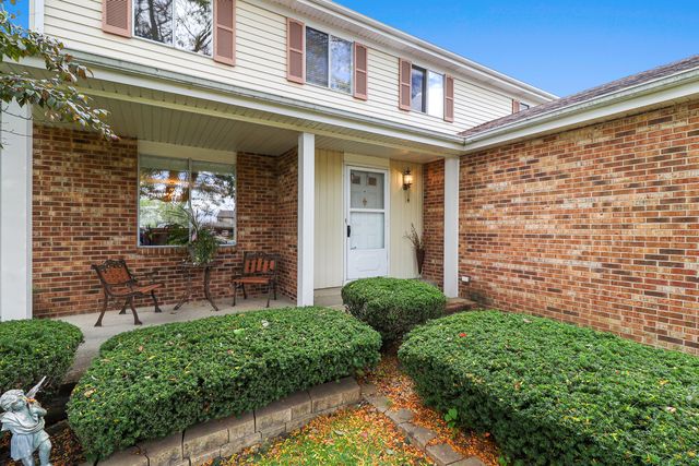 front view of a house with a small yard