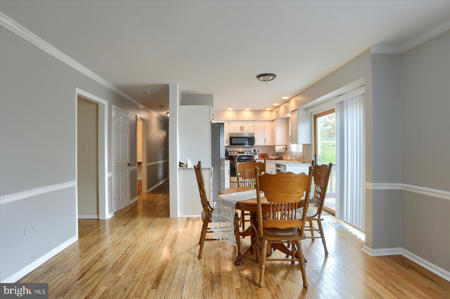 3704 Reichert Road Harrisburg, PA 17110 - Photo 11 of 44 a view of a dining room with furniture window and wooden floor