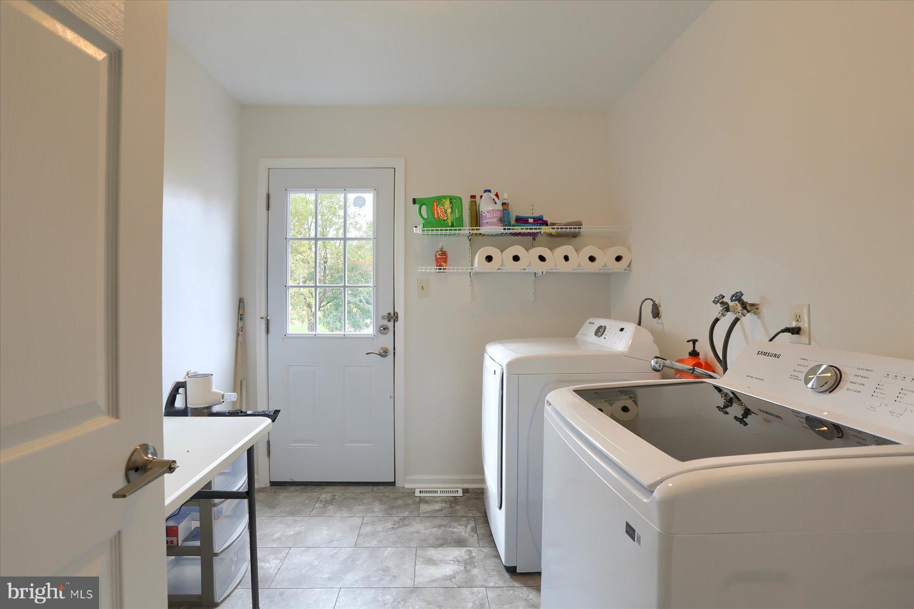 3704 Reichert Road Harrisburg, PA 17110 - Photo 15 of 44 a utility room with a window dryer and washer
