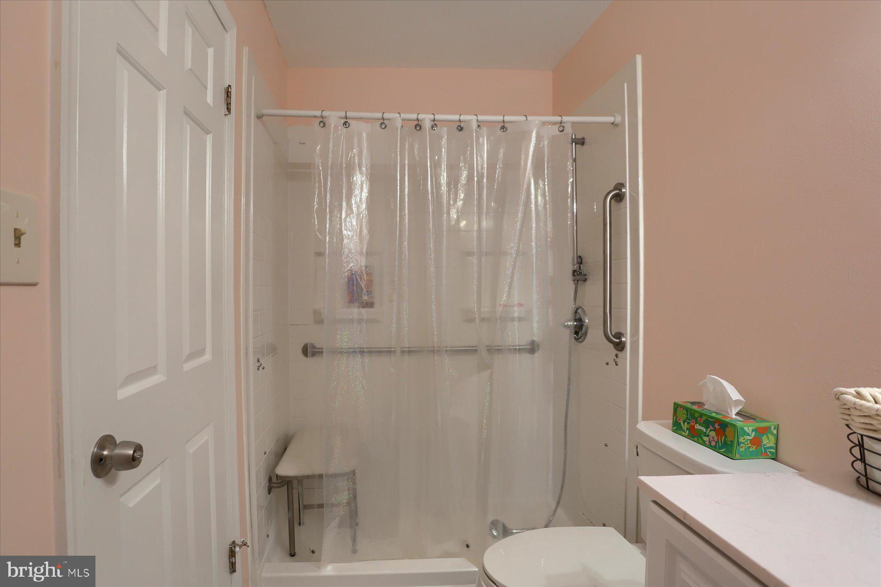3704 Reichert Road Harrisburg, PA 17110 - Photo 25 of 44 a bathroom with a toilet and a shower curtain