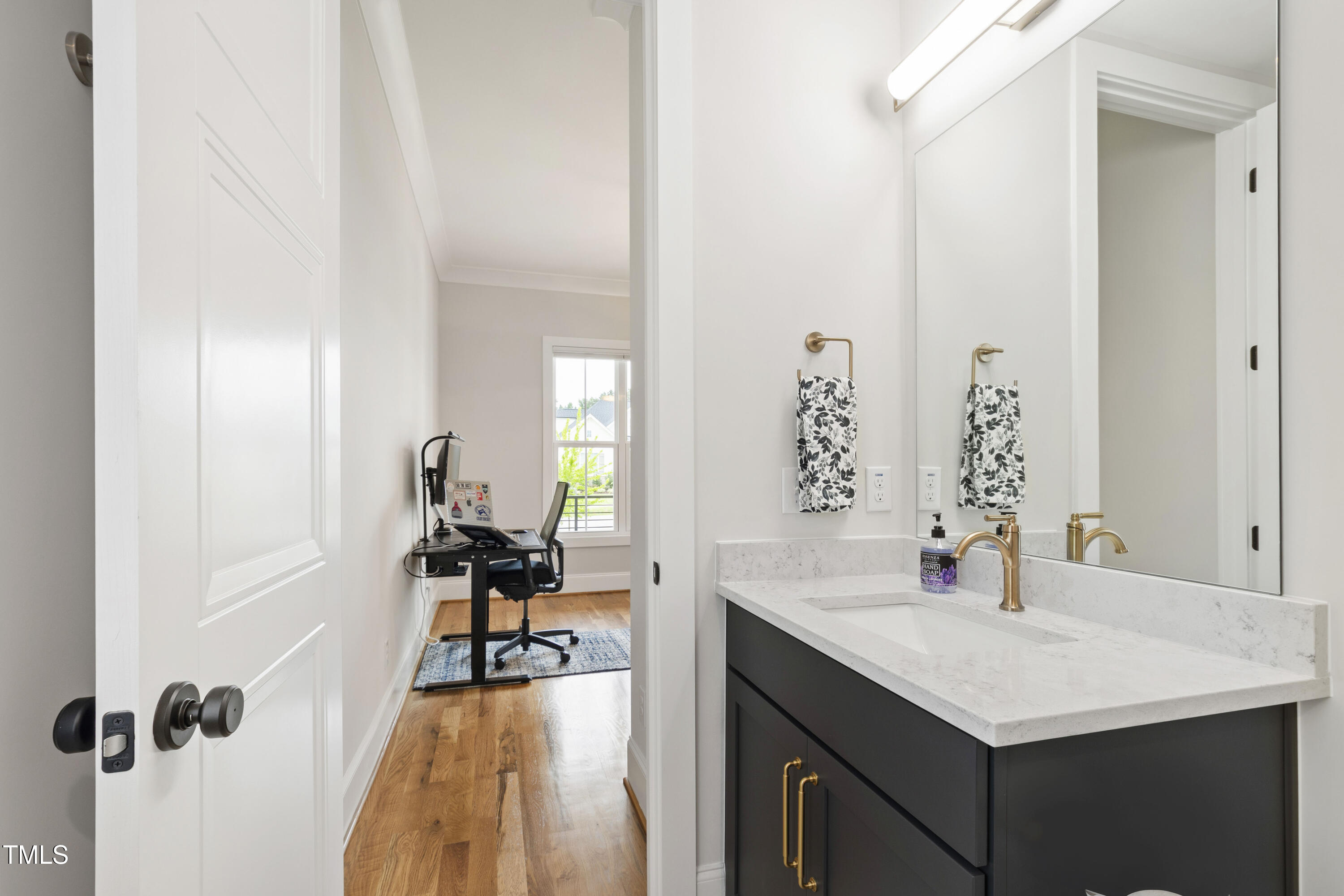 912 Lily Claire Lane Fuquay-Varina, NC 27526 - Photo 25 of 64 a en suite bathroom with a sink vanity and a mirror