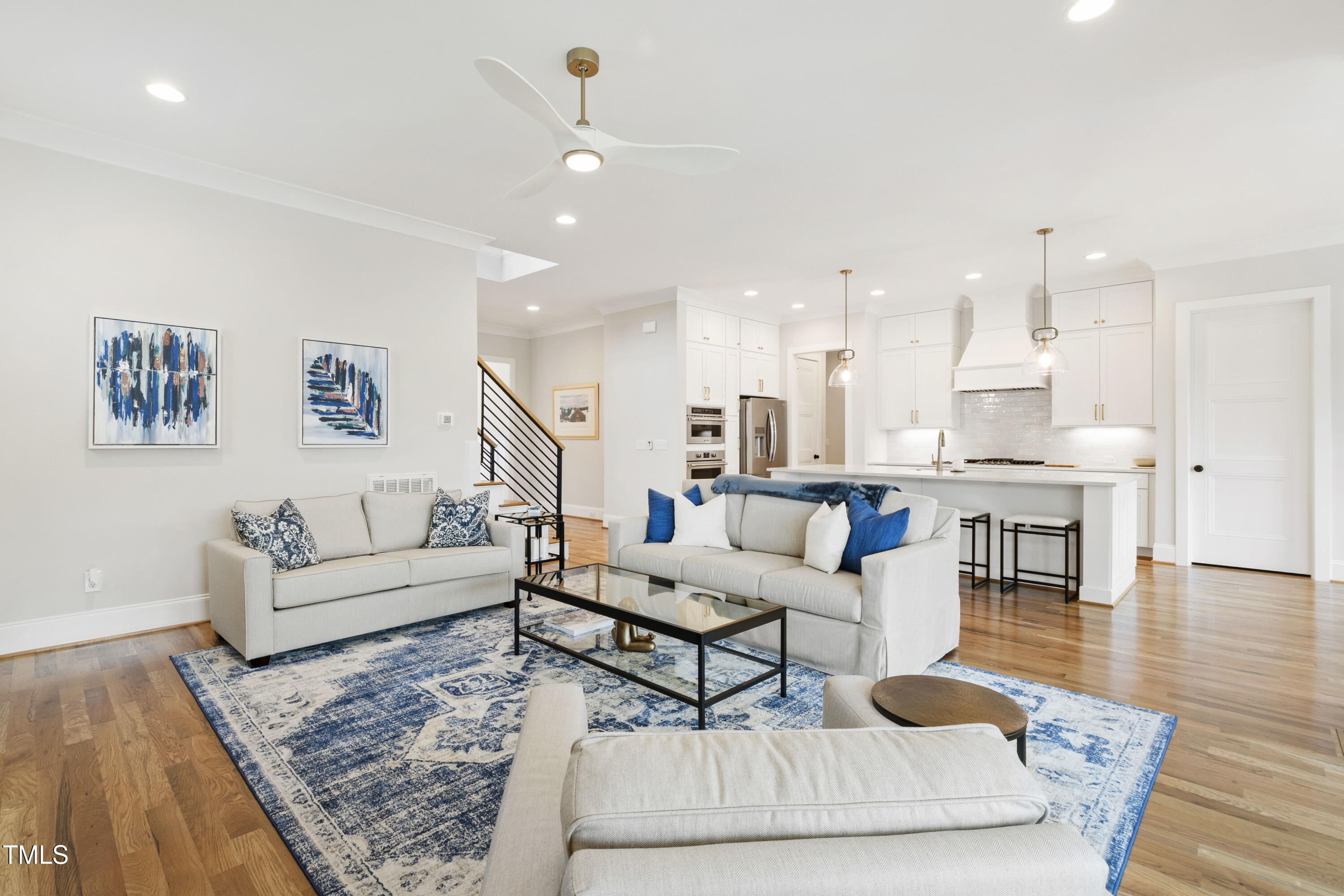 912 Lily Claire Lane Fuquay-Varina, NC 27526 - Photo 2 of 64 a living room with furniture and kitchen view