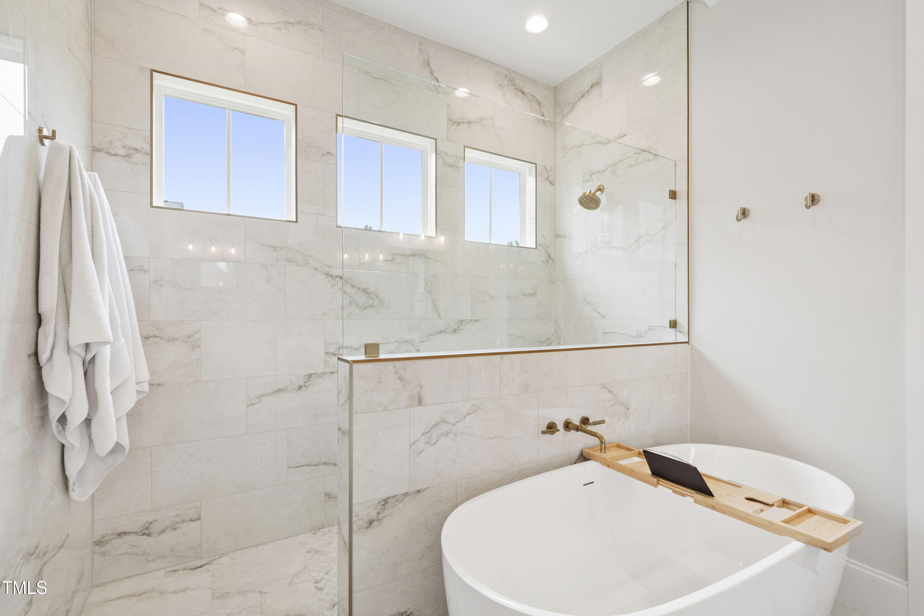 912 Lily Claire Lane Fuquay-Varina, NC 27526 - Photo 31 of 64 a bathroom with a bathtub and shower