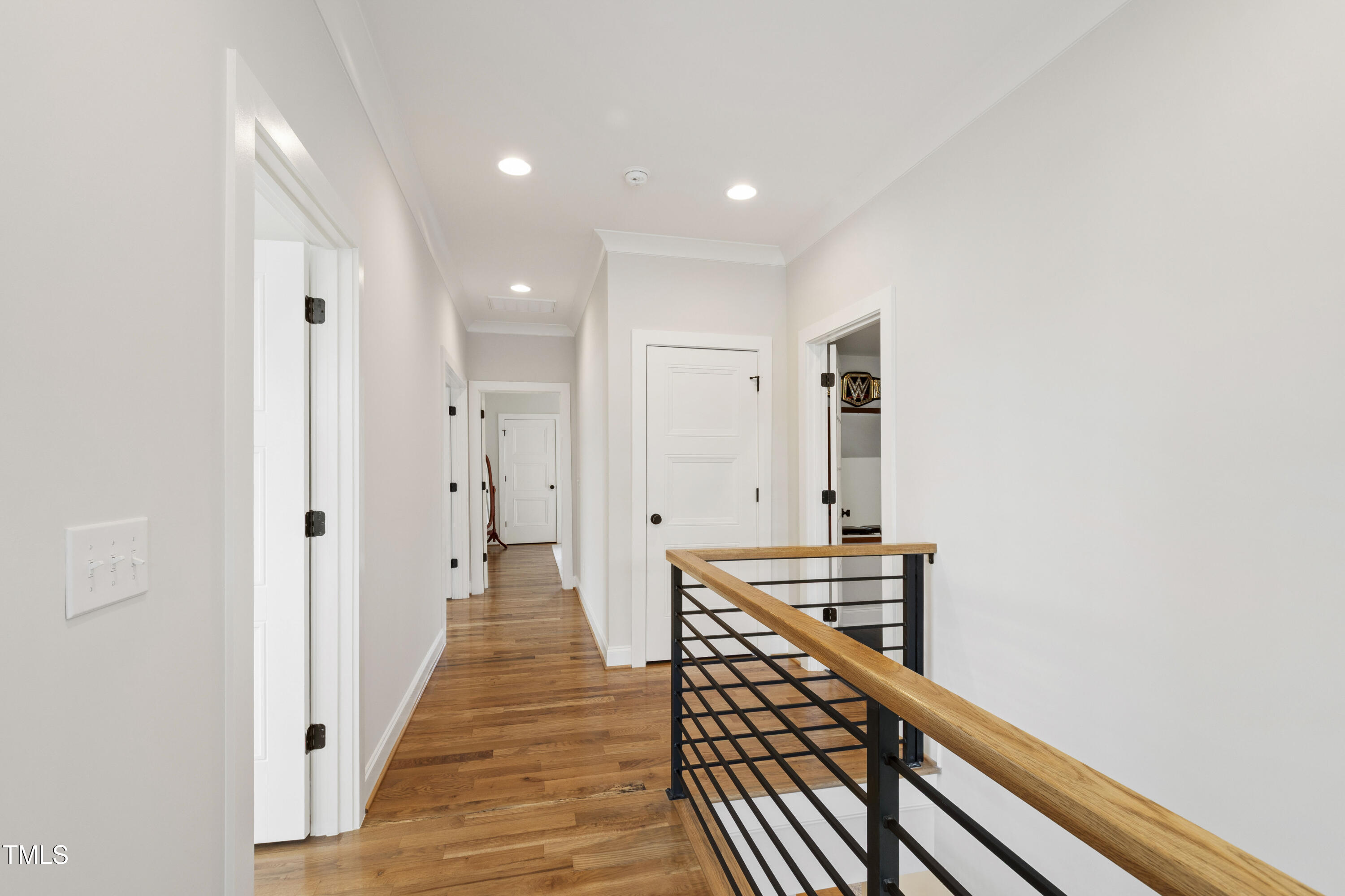 912 Lily Claire Lane Fuquay-Varina, NC 27526 - Photo 36 of 64 a view of a hallway with wooden floor