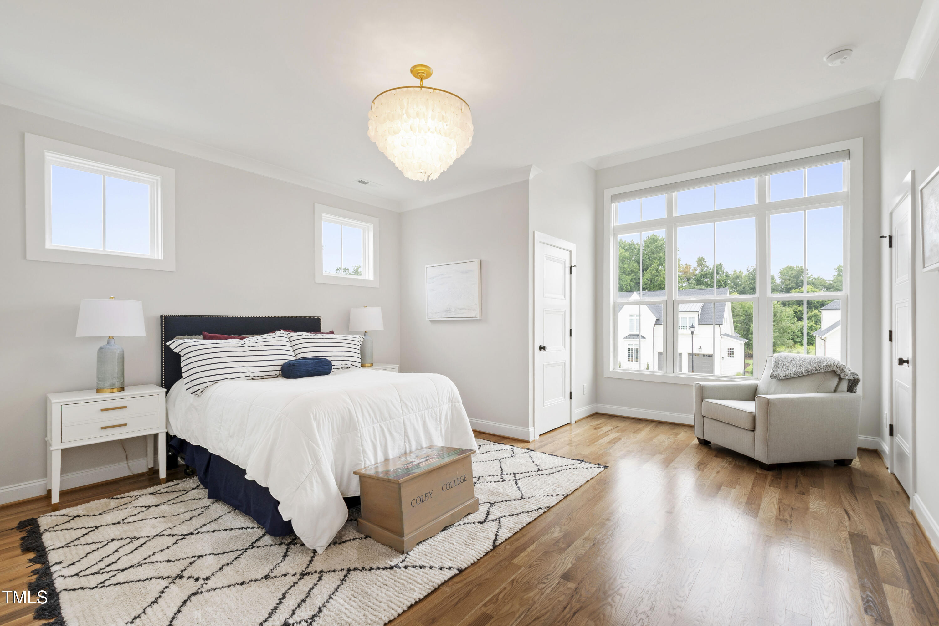 912 Lily Claire Lane Fuquay-Varina, NC 27526 - Photo 37 of 64 a bedroom with a bed and wooden floor