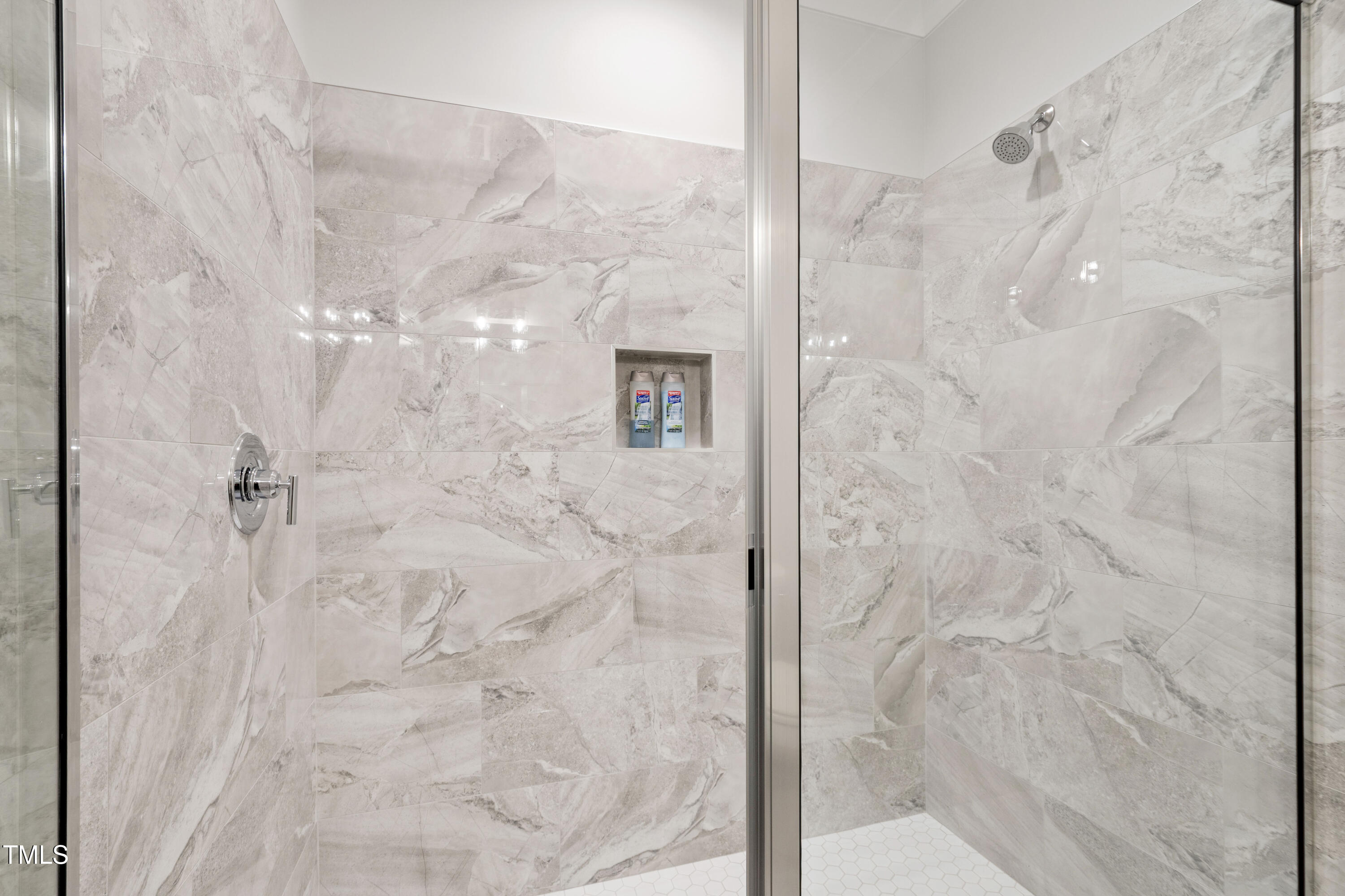 912 Lily Claire Lane Fuquay-Varina, NC 27526 - Photo 46 of 64 a bathroom with a shower