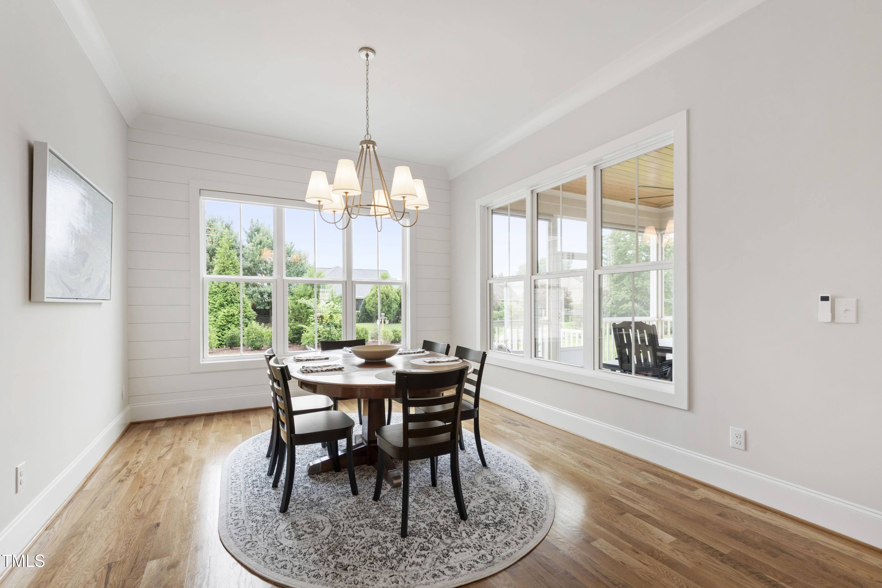 912 Lily Claire Lane Fuquay-Varina, NC 27526 - Photo 4 of 64 a view of a dining room with furniture window and wooden floor