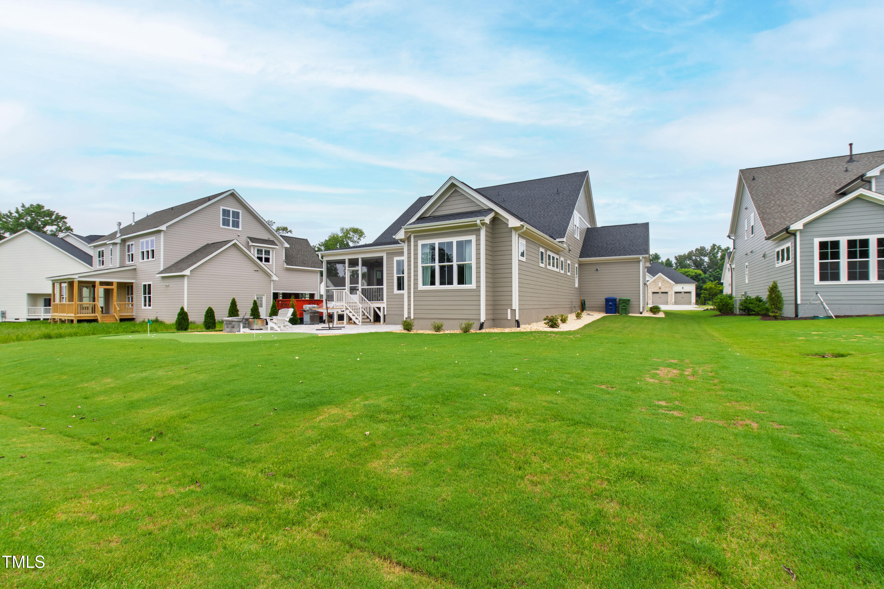 912 Lily Claire Lane Fuquay-Varina, NC 27526 - Photo 53 of 64 a view of a house with a big yard and large trees