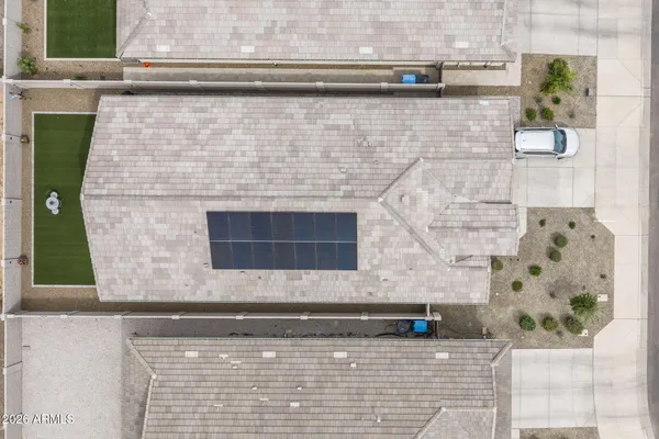 a bedroom with a bed and a mirror