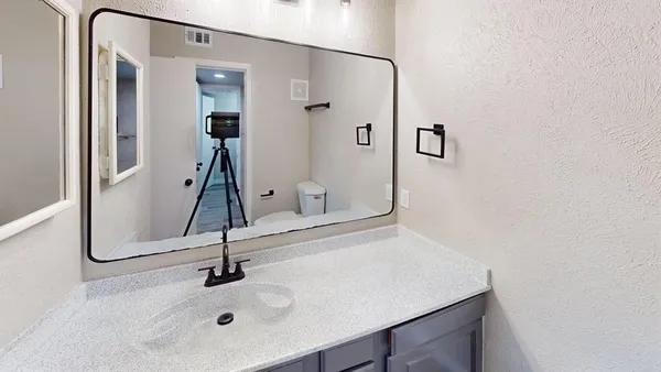 a view of hallway with wooden floor