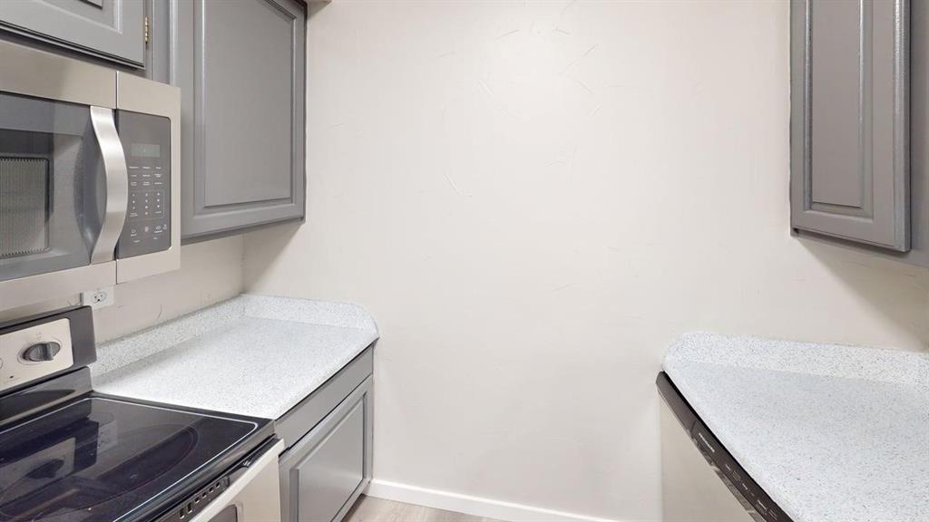 11460 Audelia Road, Unit 284 Dallas, TX 75243 - Photo 3 of 15 a view of an empty room with wooden floor